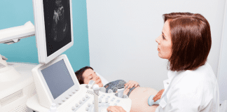 Finding a Care Provider and Hospital That’s Right For You A woman having an ultrasound.