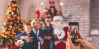 Santa Sightings A family taking a photo with Santa.