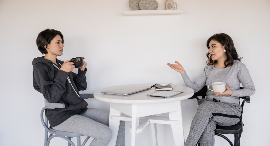 Two women having a conversation.