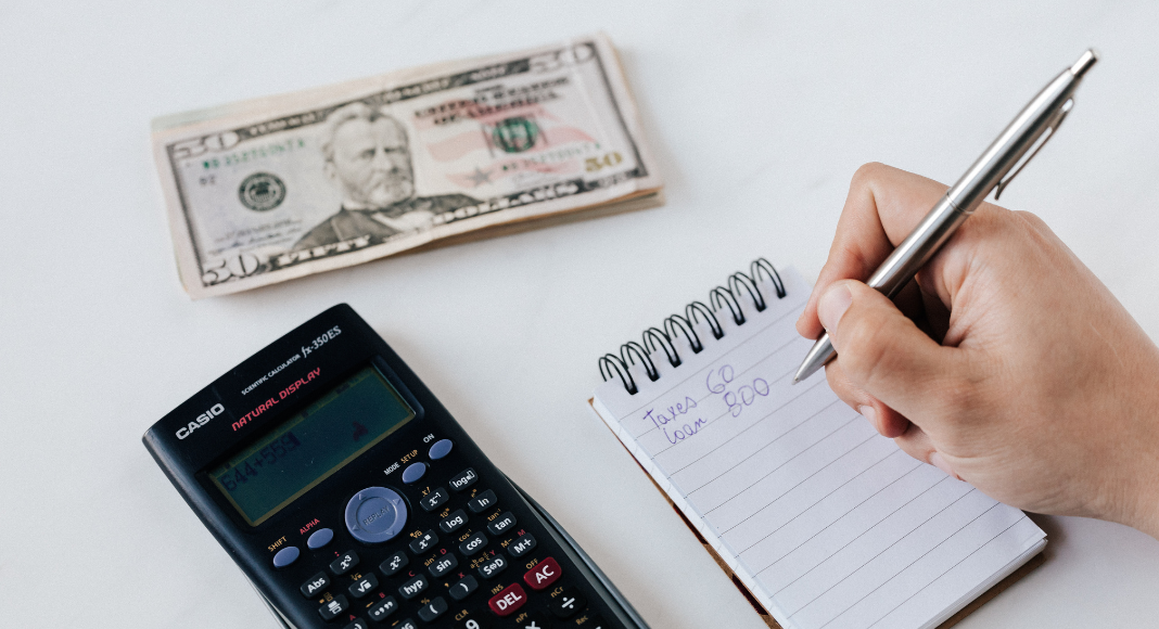 Taking notes on finances.