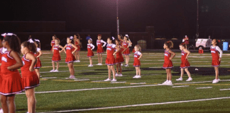Friday Night Lights: Our First Experience with Team Sports A cheerleading squad.