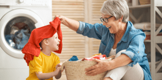 grandma helping a child with the laundry.