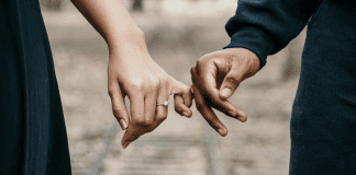 How I Met Your Father: 30 Years, 30 Things Holding hands by your pinky finger.