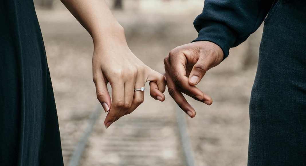Holding hands by your pinky finger.