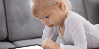My Family’s Relationship with iPads is a Dirty Secret A little girl playing on her iPad.