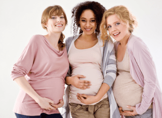 Pregnant women smiling.
