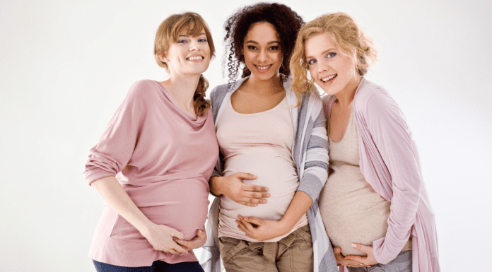 Pregnant women smiling.