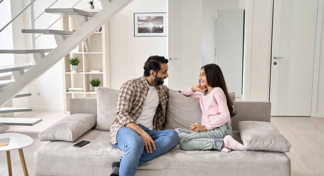 A dad talking to a teen.
