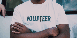 Let’s Hear it for Local Volunteers! Send Us Your Shout Outs! A man wearing a volunteer t-shirt