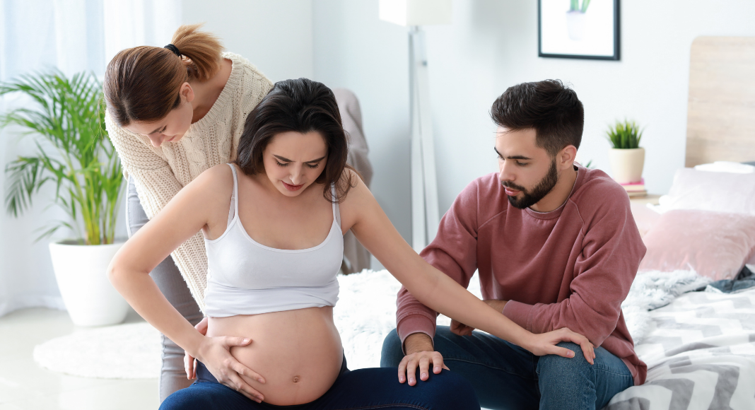 A woman experiencing a home birth.