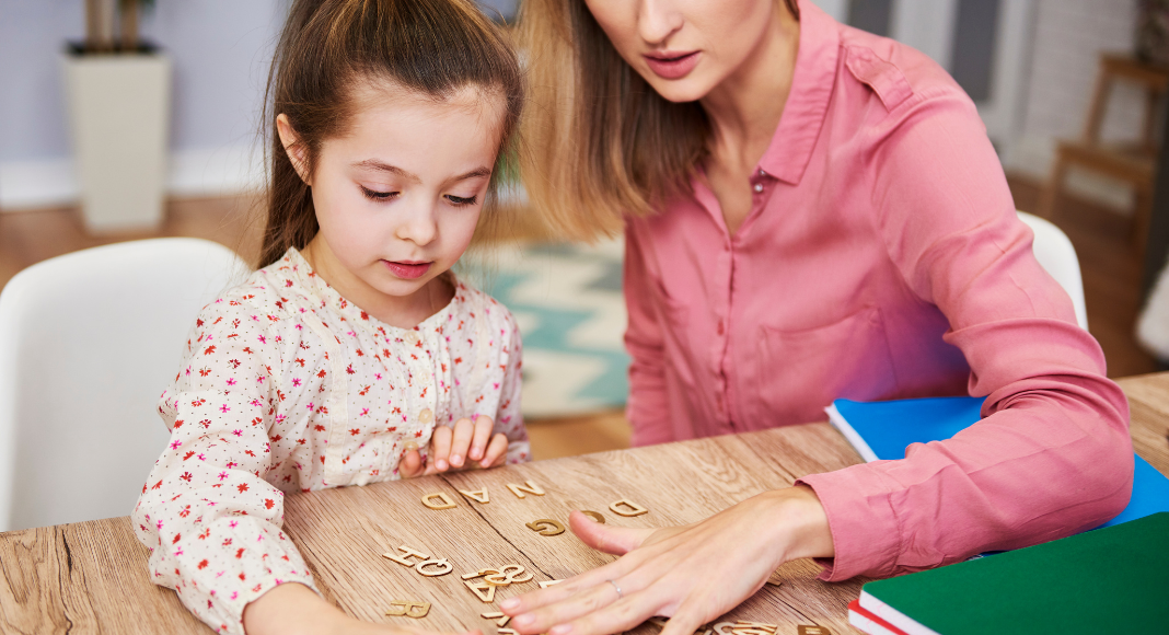 A mother helping her child learn.