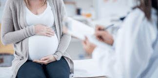 A pregnant woman at the doctor.