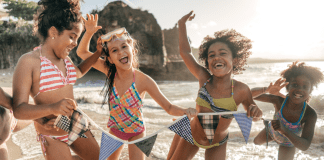 Girls running on the beach.