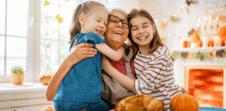 Why Thanksgiving Has a New Meaning Once You Have Kids A grandmother with children on Thanksgiving.