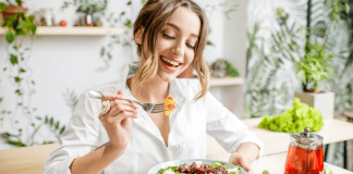 Fixing Your Food to Improve Your Mood (and other beneficial side-effects) A woman eating a healthy salad.