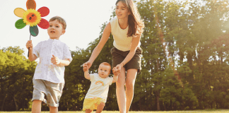 A mother walking with her chidren.