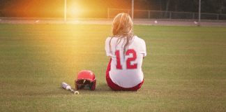 When Practice Doesn’t Make Perfect A softball player sitting in the middle of the field.