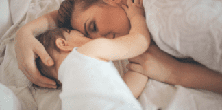 Enjoy Every Moment A mom snuggling with her son.