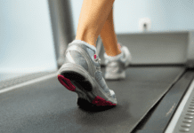 Feet walking on a treadmill.