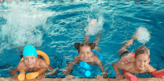 DIY Winter Beach Birthday Party Children at an indoor pool party.