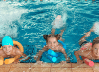 Children at an indoor pool party.