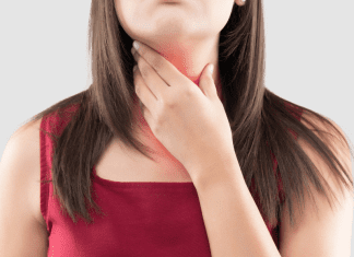 A woman feeling her thyroid.