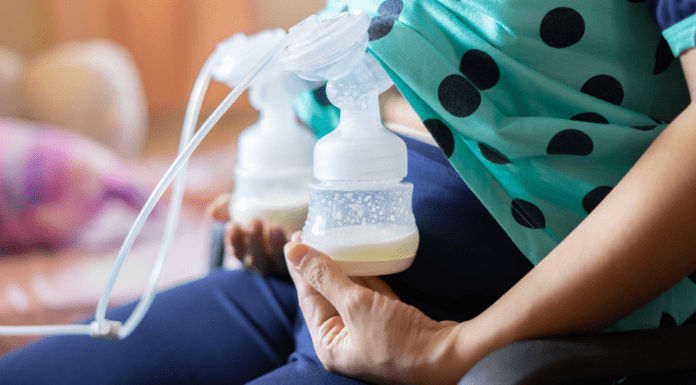 Pumping Essentials A woman with a breast pump attached.