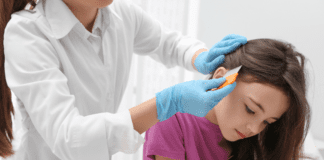 A Lice Free Noggin A girl getting a lice exam.