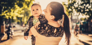 A mom holding her son.