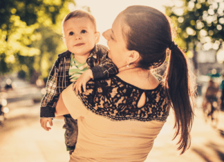 A mom holding her son.