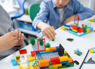 Kids Big and Small Come To Alay at LEGOLAND Discovery Center Playing with Legos.
