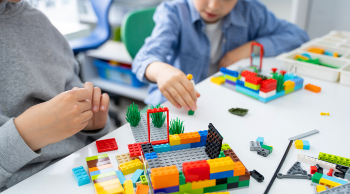 Kids Big and Small Come To Alay at LEGOLAND Discovery Center Playing with Legos.