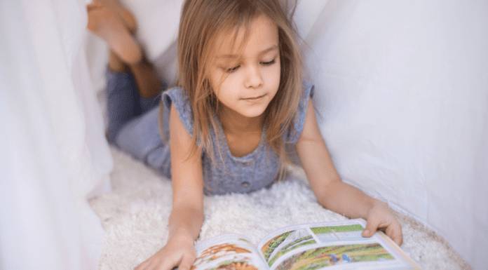 Raising Reluctant Readers A girl reading a graphic novel.