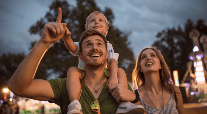 Westchester Moms’ Guide to Summer Fairs and Festivals A family at a summer fair.