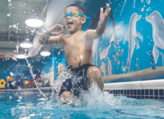 Water Safety Info Every Family Needs to Know A boy jumping into the pool.