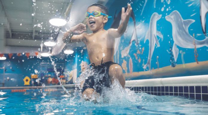 Water Safety Info Every Family Needs to Know A boy jumping into the pool.