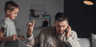 A distracted dad on the computer making his son wait.