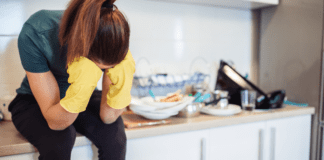When the Going Gets Tough A woman sitting on a messy counter.