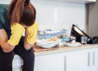 When the Going Gets Tough A woman sitting on a messy counter.