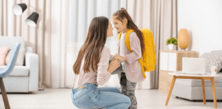 A mom talking to her daughter before school.