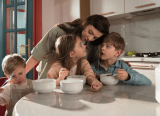 Playing Favorites A mom with her children eating cereal.