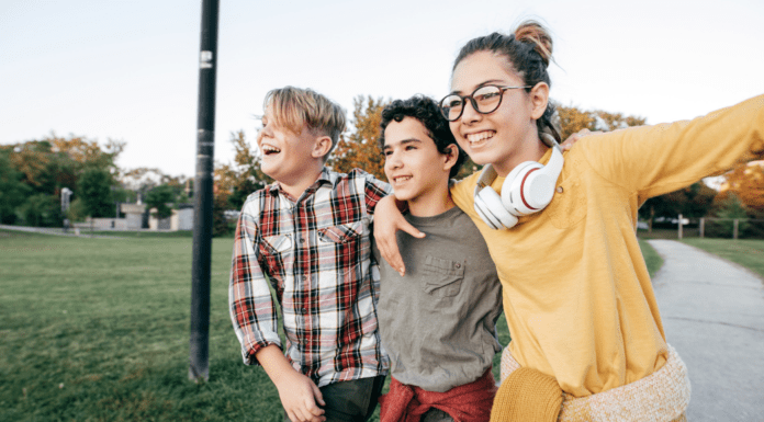 To My Two Eldest Children, In A Year of Transitions Teens walking on a sidewalk.