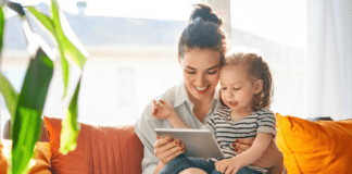 A mother reading to her daughter.