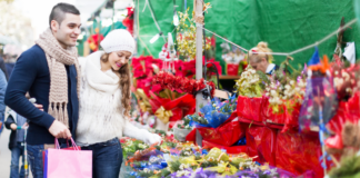 Craft Fairs, Markets, and Pop Up Shops A couple shopping at a holiday craft fair.