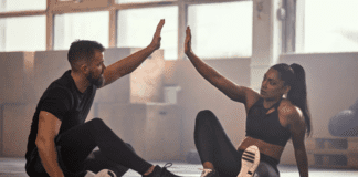 2019 Fitness, Health & Wellness Guide A woman with her fitness coach.