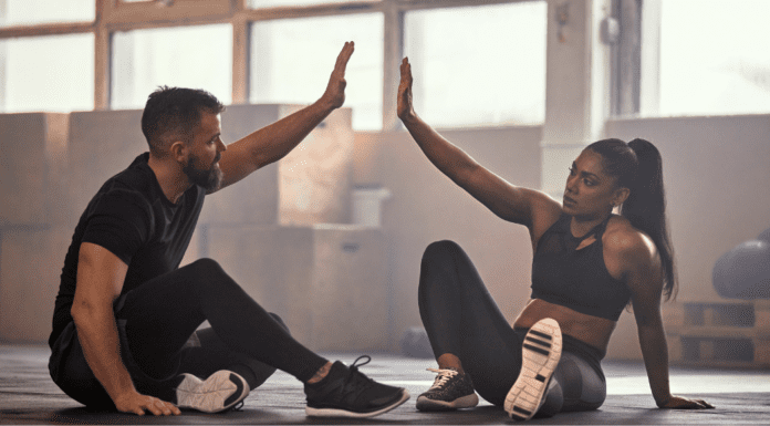 A woman with her fitness coach.