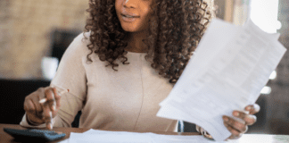 A woman looking through her finances and Taxes.
