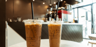 Iced coffees on a table at a coffee house.