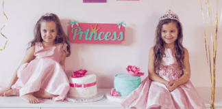 Two girls in pink princess dresses.