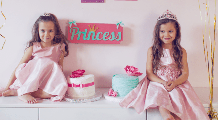 Two girls in pink princess dresses.